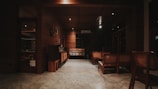 Cozy room interior with wooden furniture and soft natural lighting.