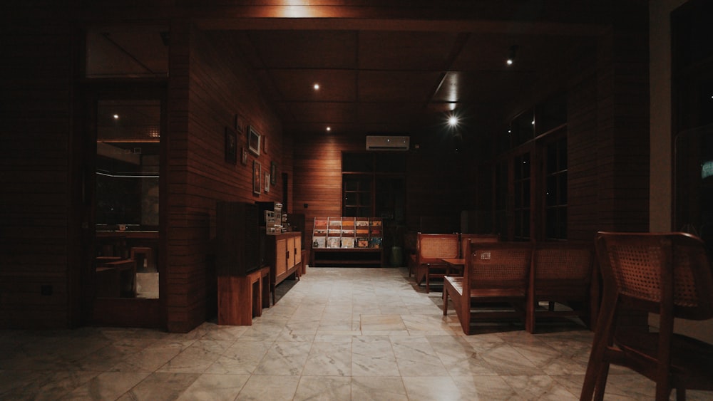 brown wooden chairs and tables in room