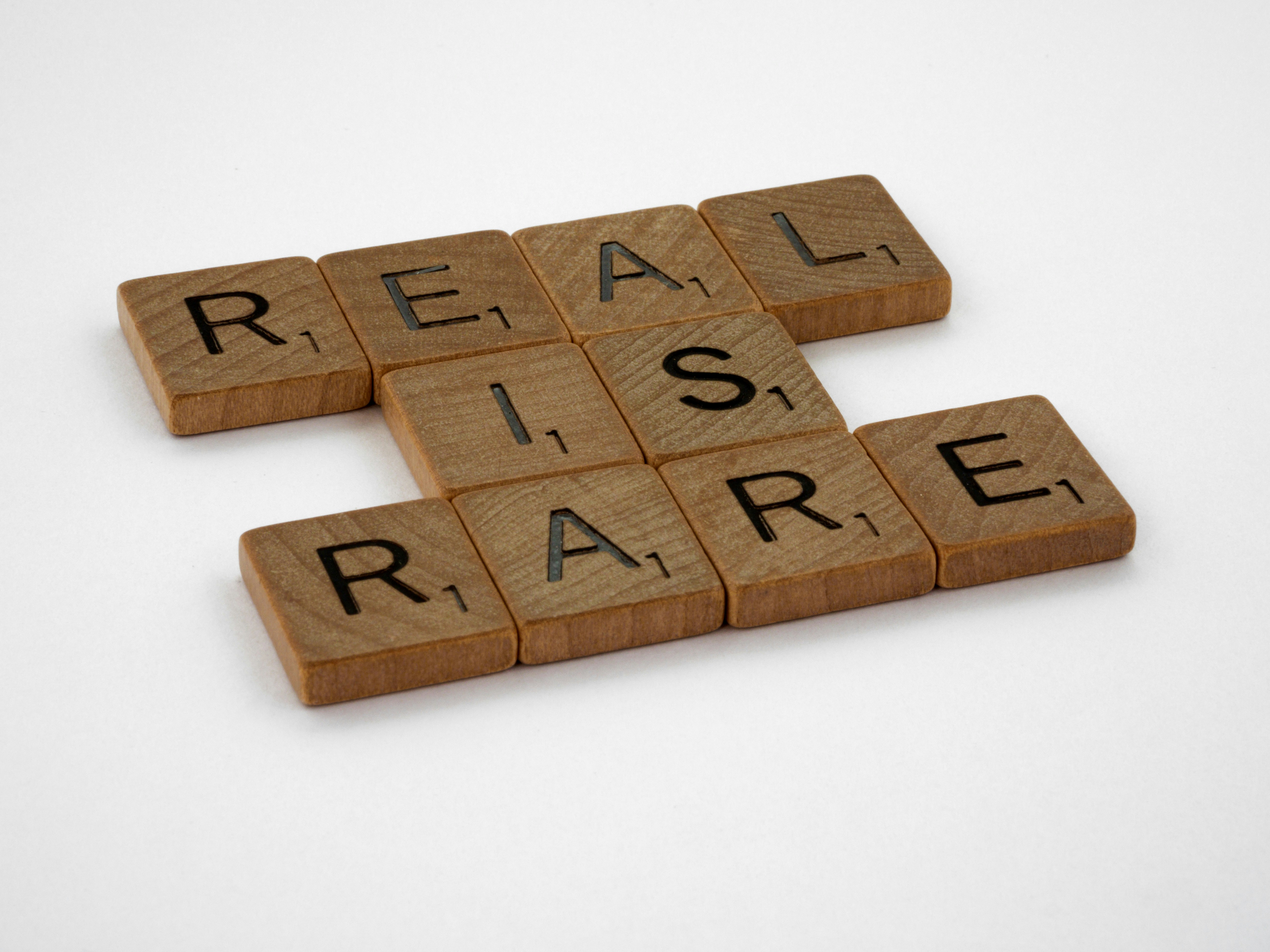 scrabble, scrabble pieces, lettering, letters, wood, scrabble tiles, white background, words, quote, letters, type, typography, design, layout, focus, bokeh, blur, photography, images, image, real is rare, authenticity, authentic, truth, real, fake, superficial, instagram, photoshop, snapchat, genuine,