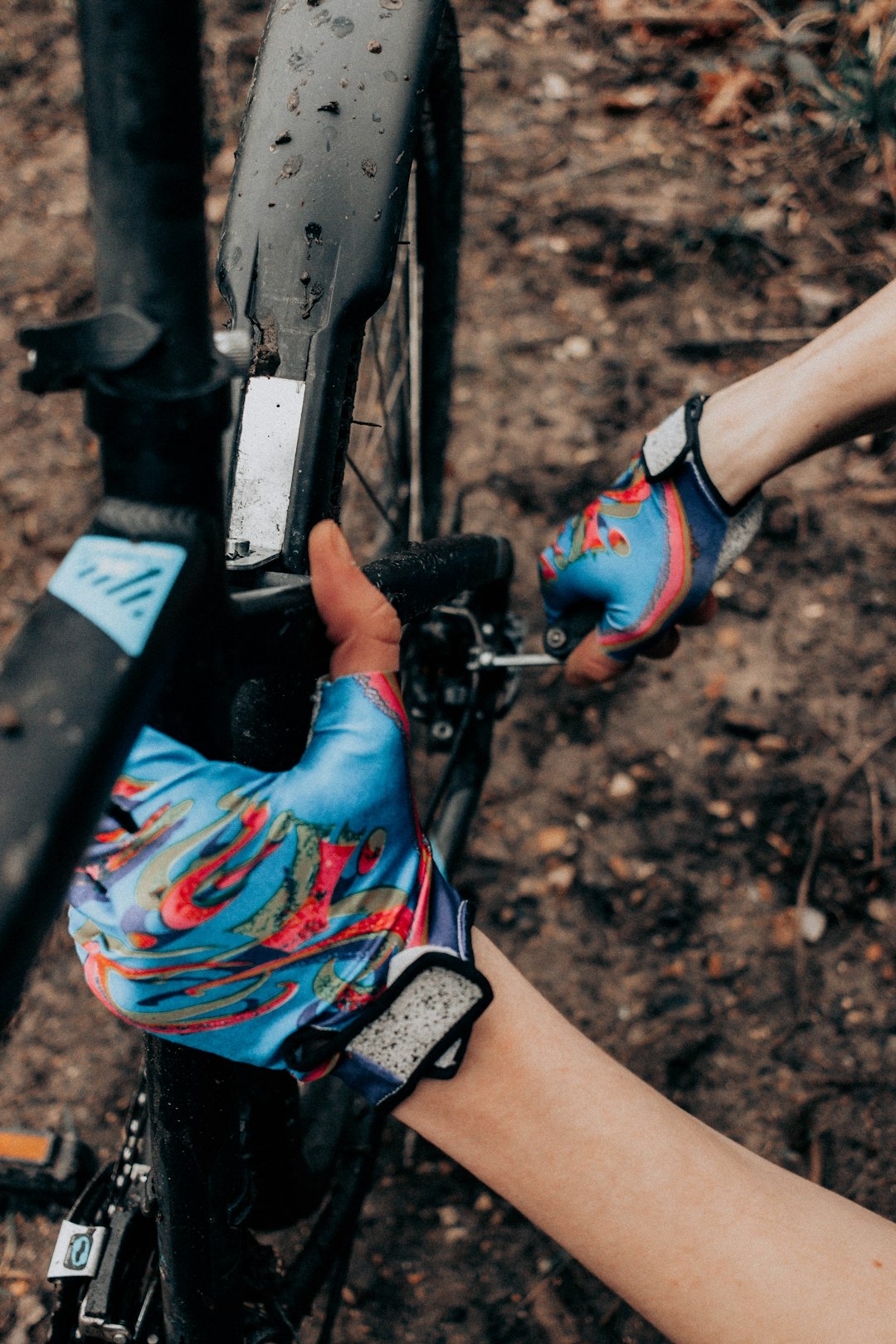 person in blue and red shorts riding on bicycle