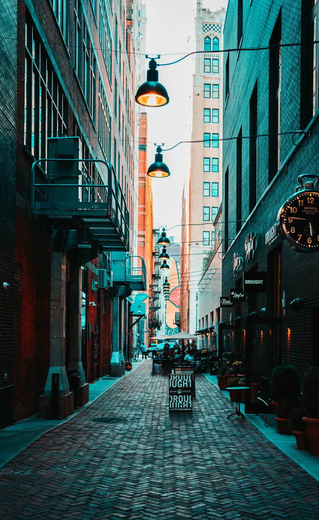 people walking on sidewalk near buildings during daytime