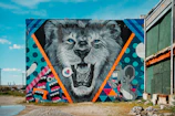 Local artists painting murals inspired by the spirit of the lion festival.