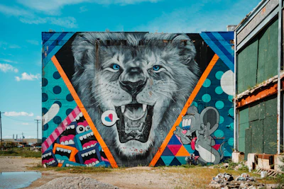 Local artists painting murals inspired by the spirit of the lion festival.