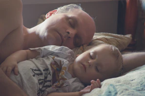 A peaceful bedtime setting with a child and their favorite character winding down together.