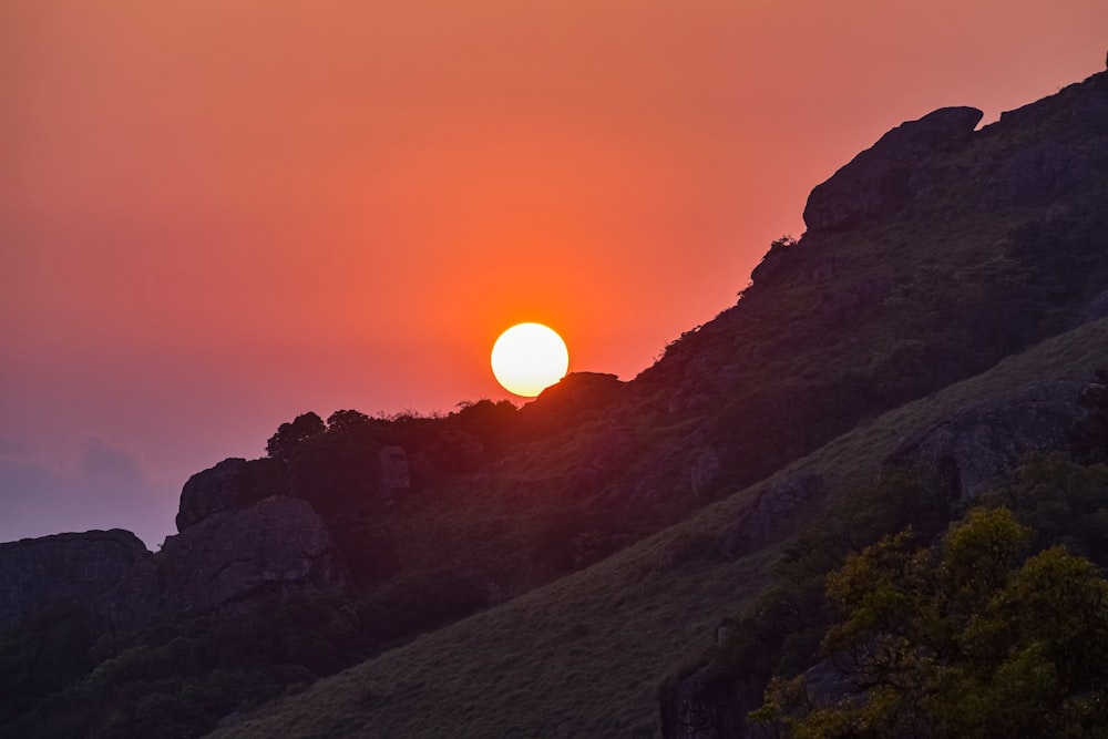 silhouette of mountain during sunset