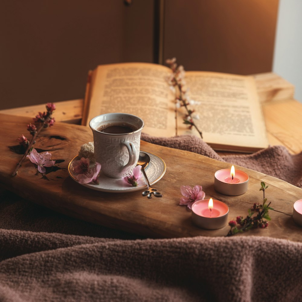 white ceramic teacup on brown wooden tray