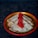 A decorative plate holds several folded crepes with golden brown spots. A generous amount of vibrant red caviar is placed on top of the crepes, adding a touch of elegance to the dish. The plate has a colorful border, enhancing the visual appeal against the dark background.