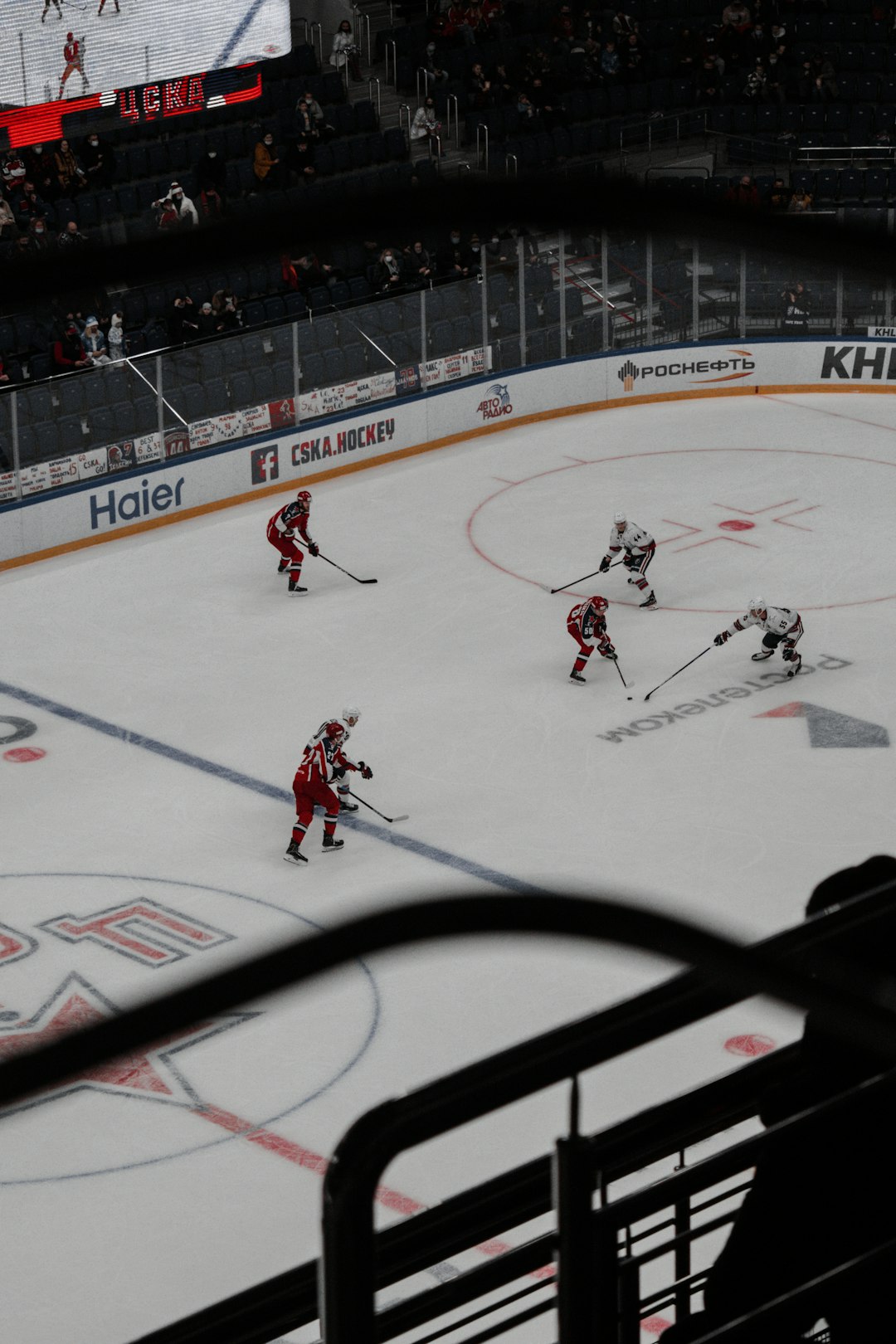 people playing ice hockey on ice field