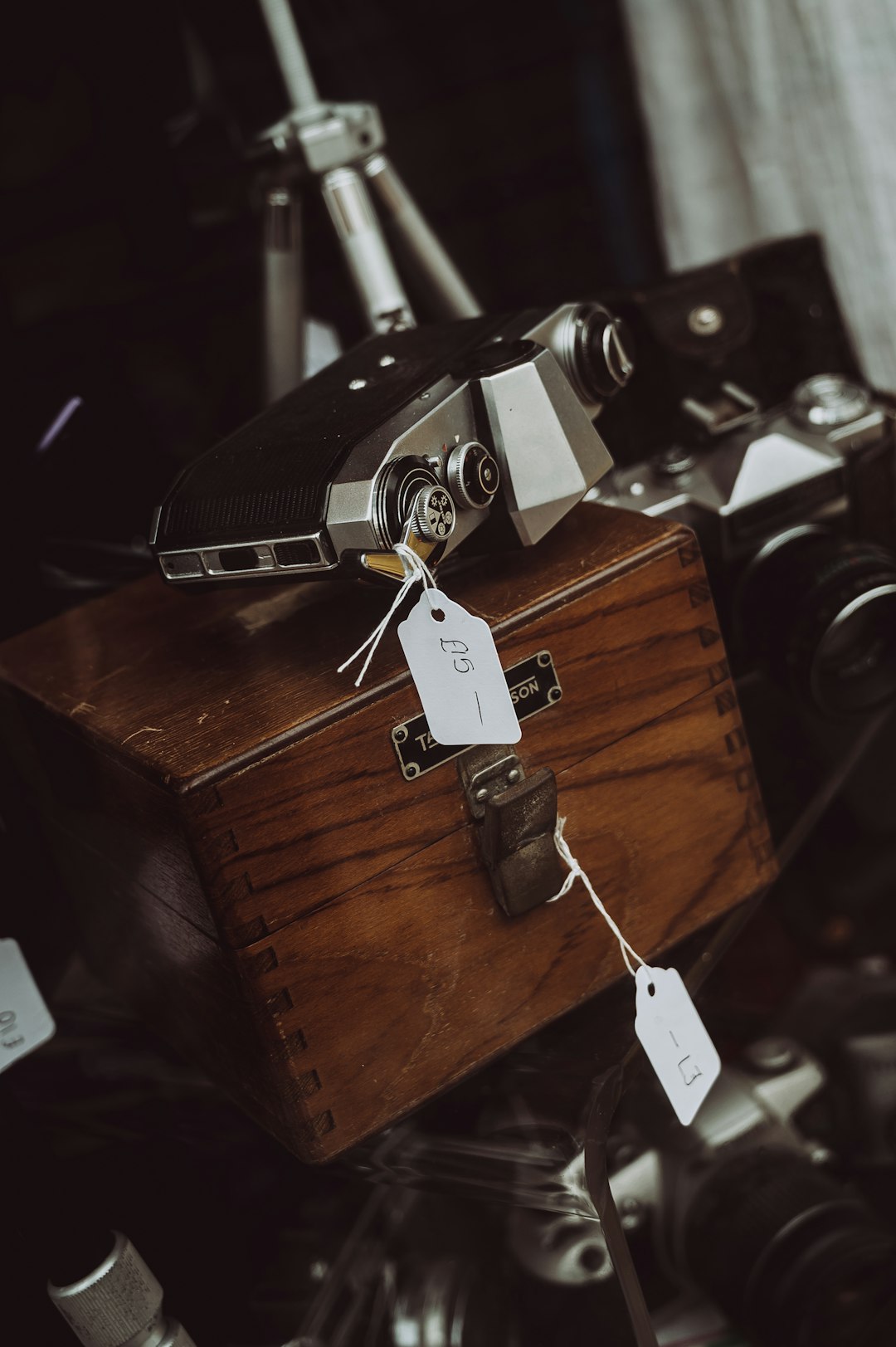 black and silver car key on brown wooden box