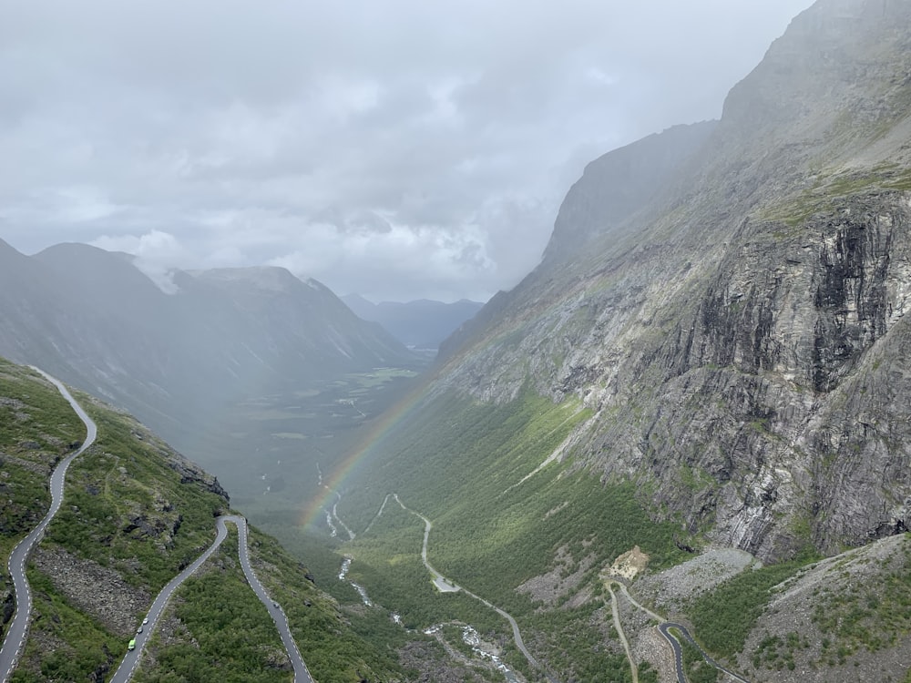 green mountains under white clouds during daytime