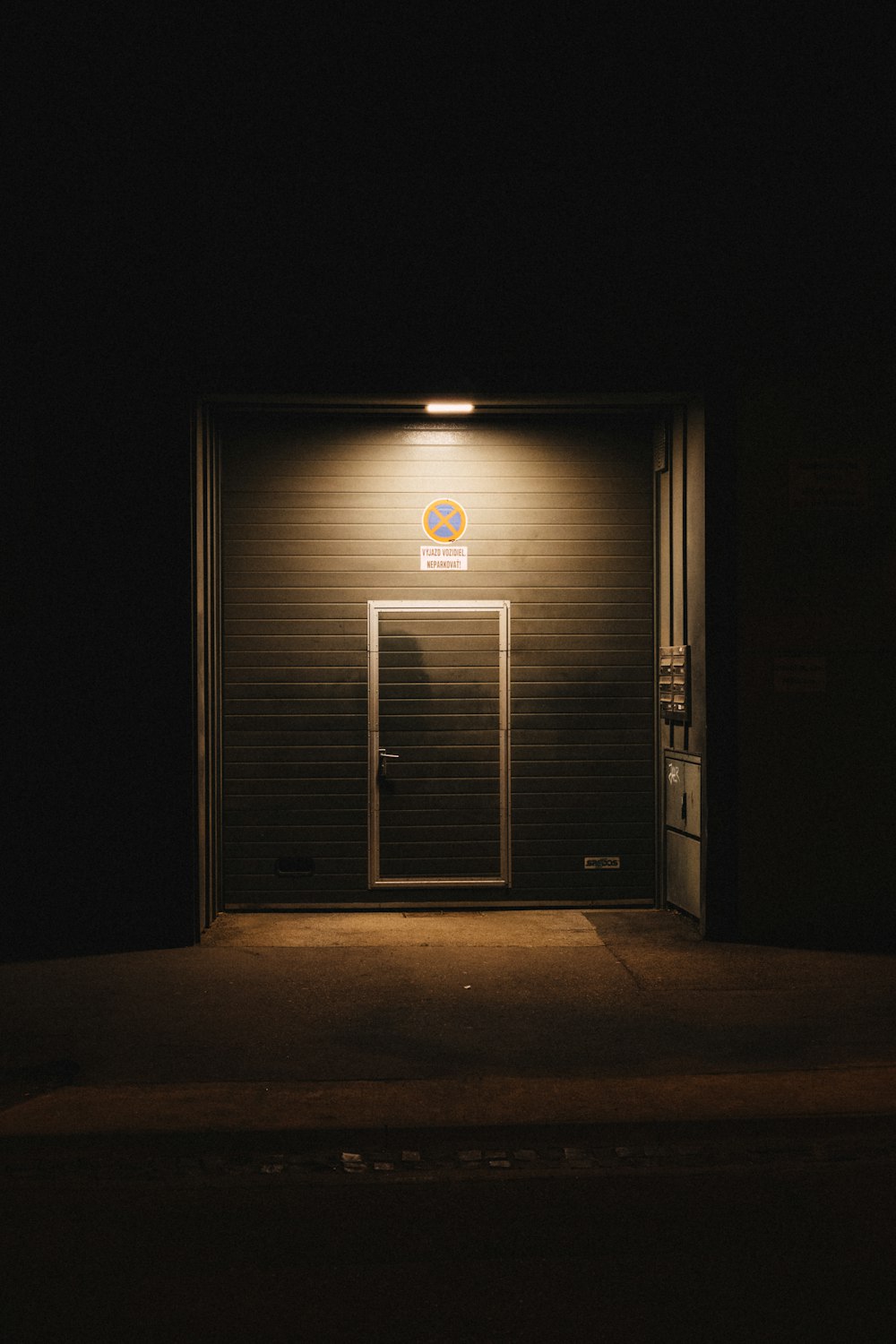 gray wooden door with white light