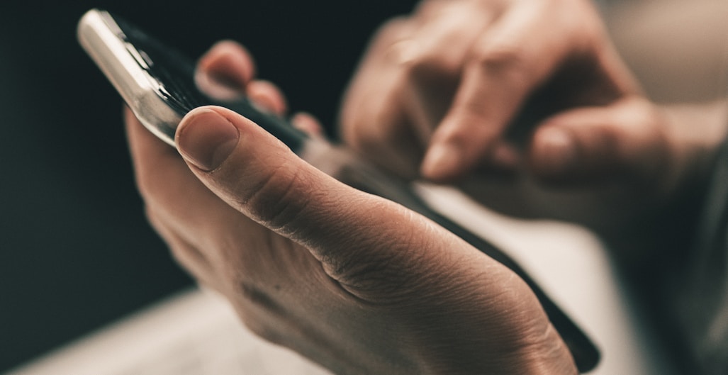 person holding black and white pen