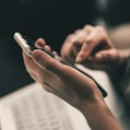 person holding black and white pen