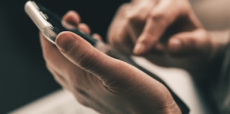 person holding black and white pen