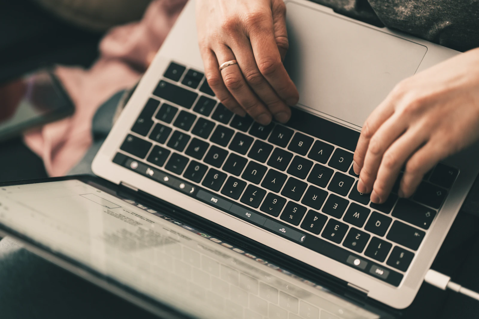 Person typing an email on a laptop at a desk