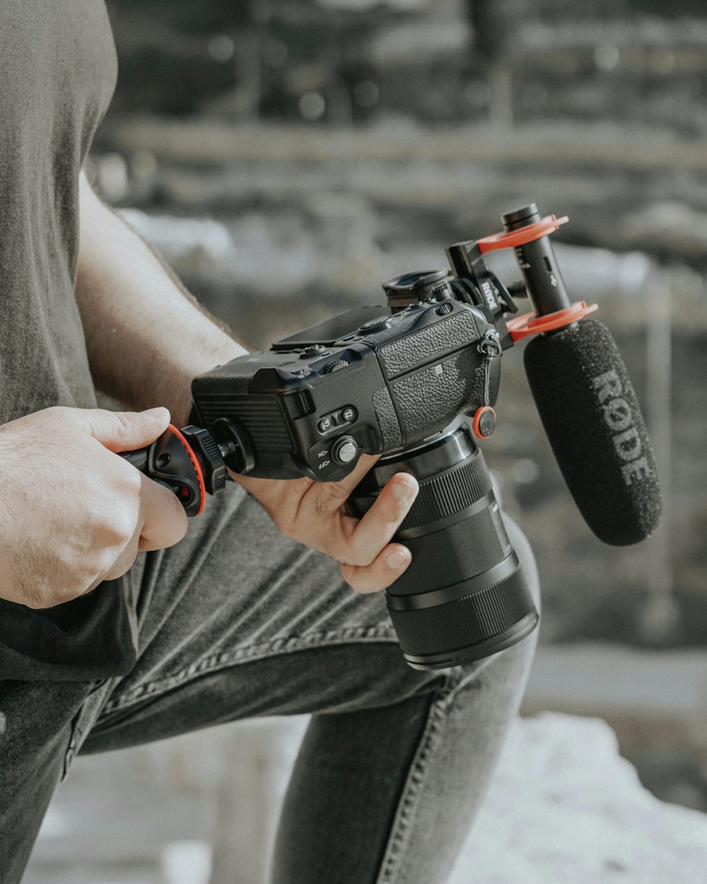 person holding black dslr camera