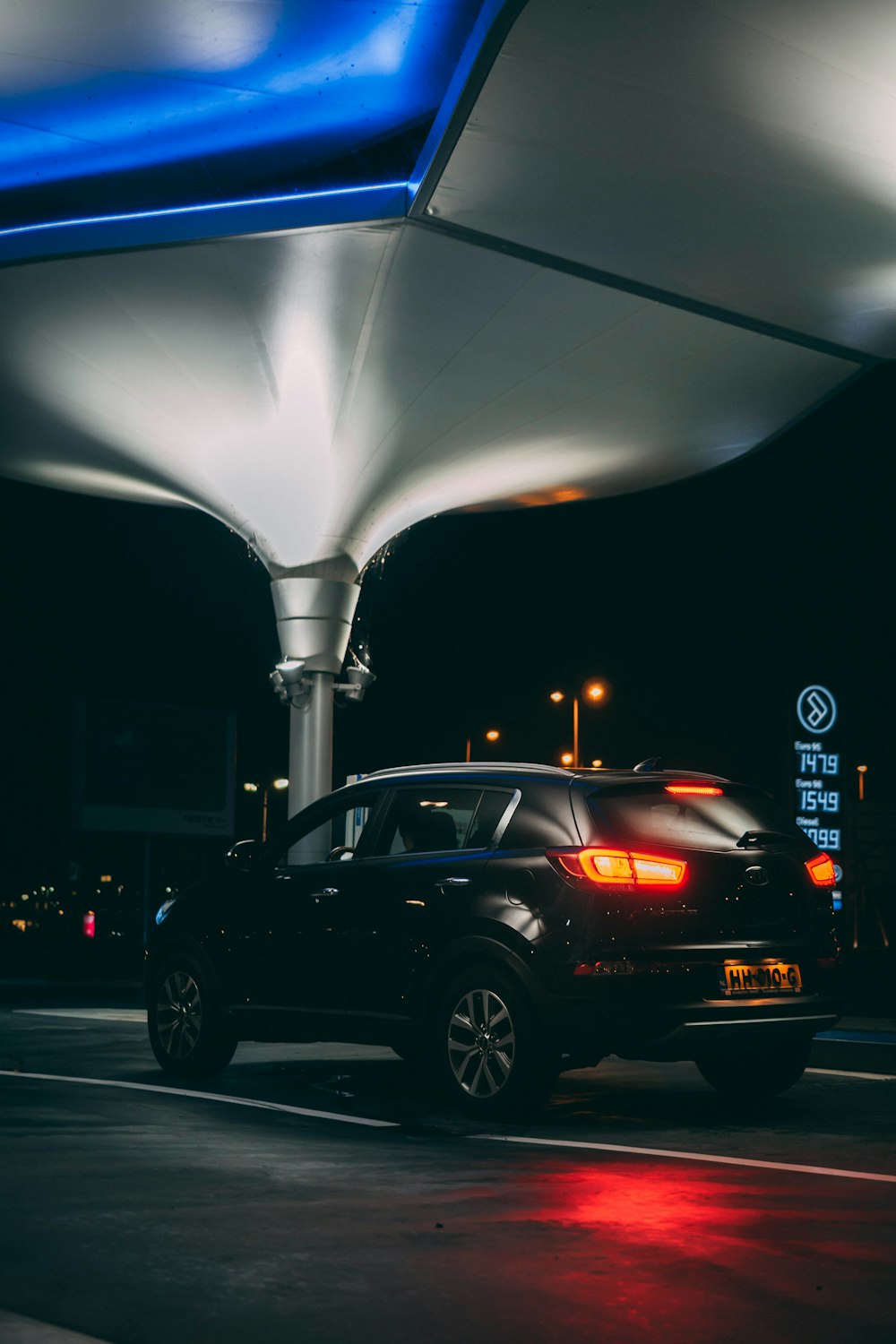 black suv on road during night time