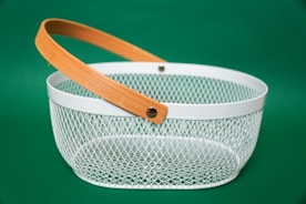 white and brown basket with blue background