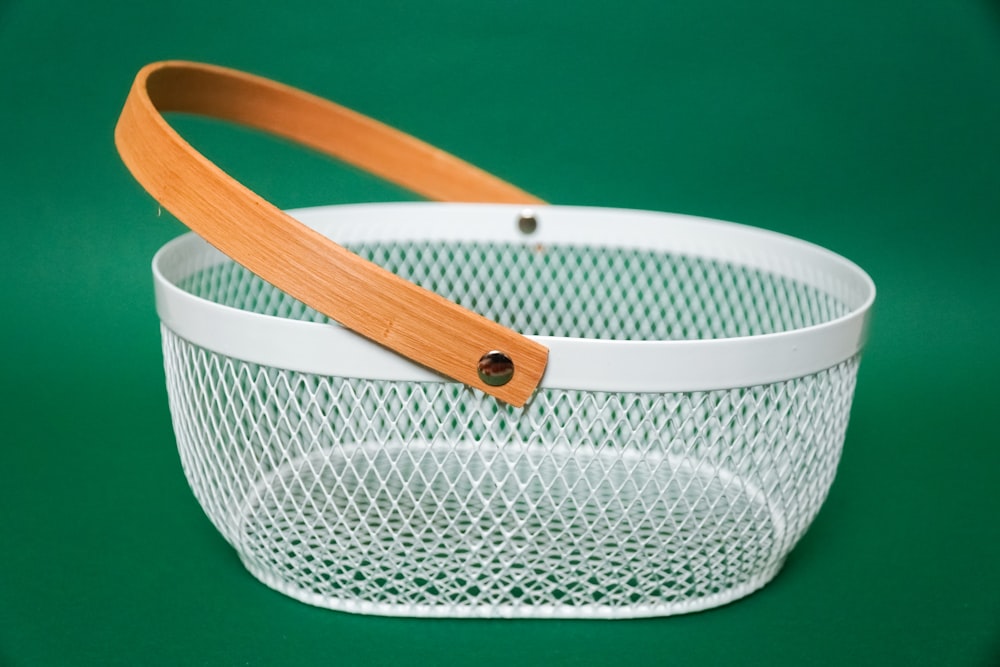 white and brown basket with blue background