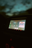 Neon-lit dashboard displaying the geermix song builder interface inside a sleek, modern vehicle.