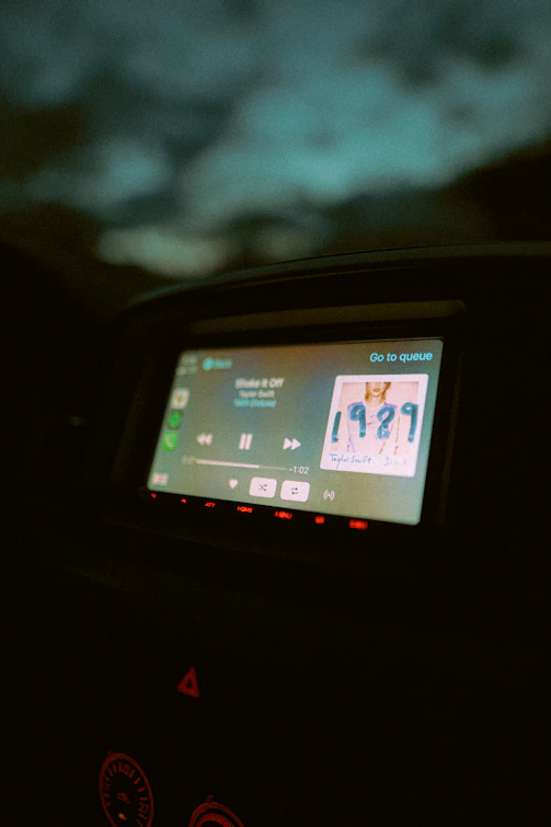 A vibrant dashboard screen showing music release schedules and artist stats.