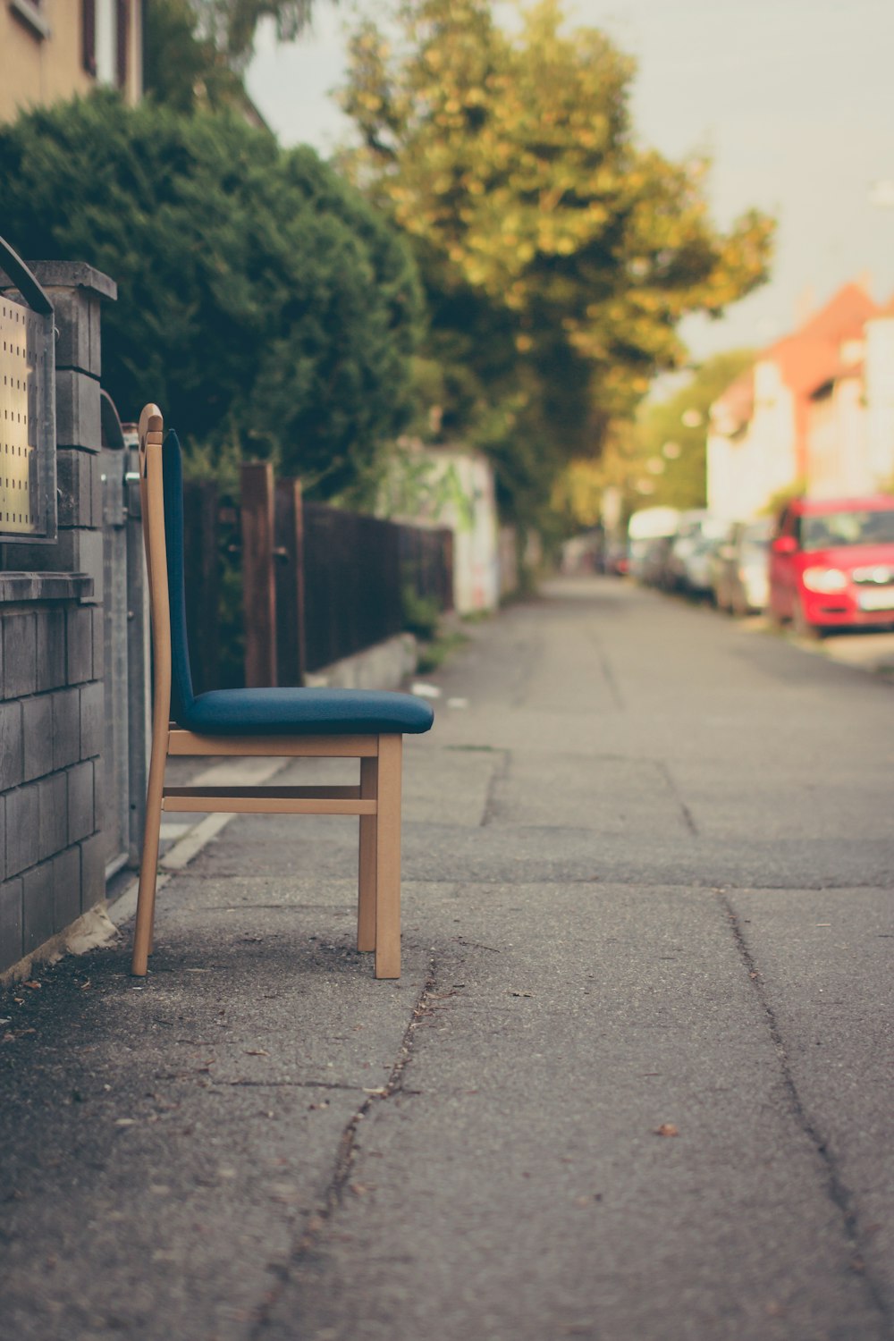 brown wooden bench on gray concrete floor