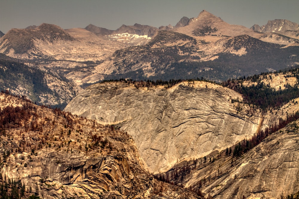 brown and white mountains under blue sky during daytime