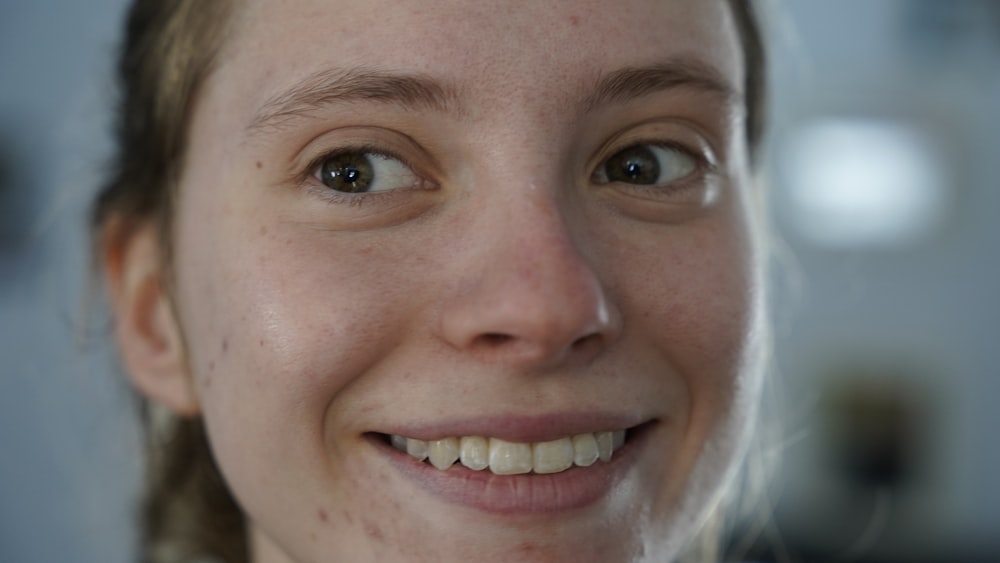 smiling woman in white shirt