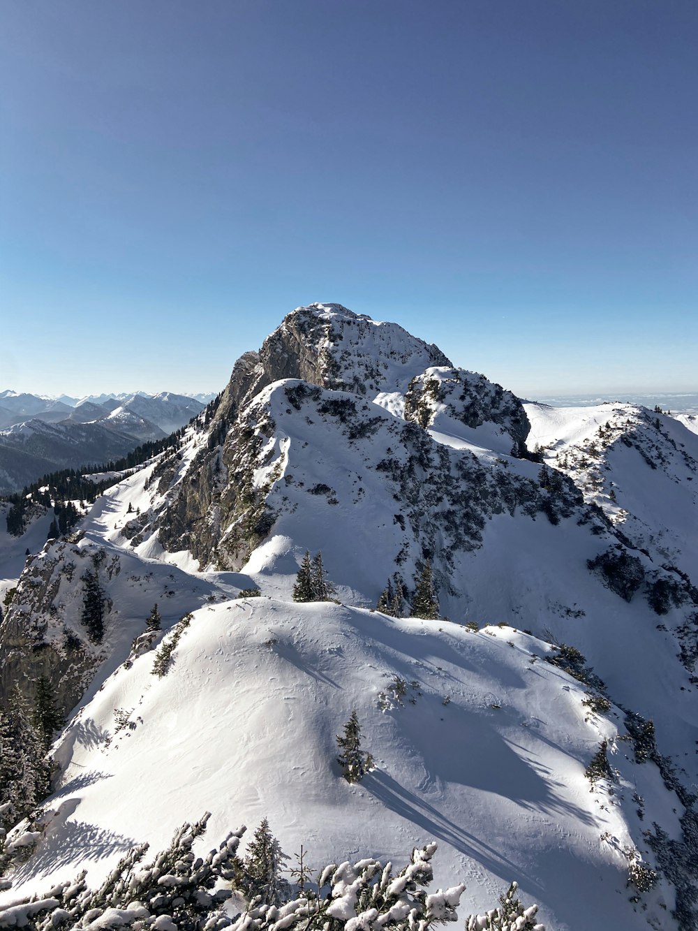 snow covered mountain under blue sky during daytime