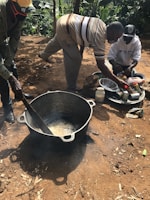 Community members engaging in a cooking demonstration outdoors