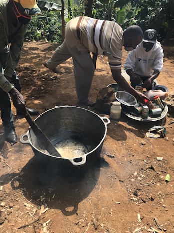 Guests participating in a river-side cooking activity.