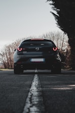 black bmw m 3 on road