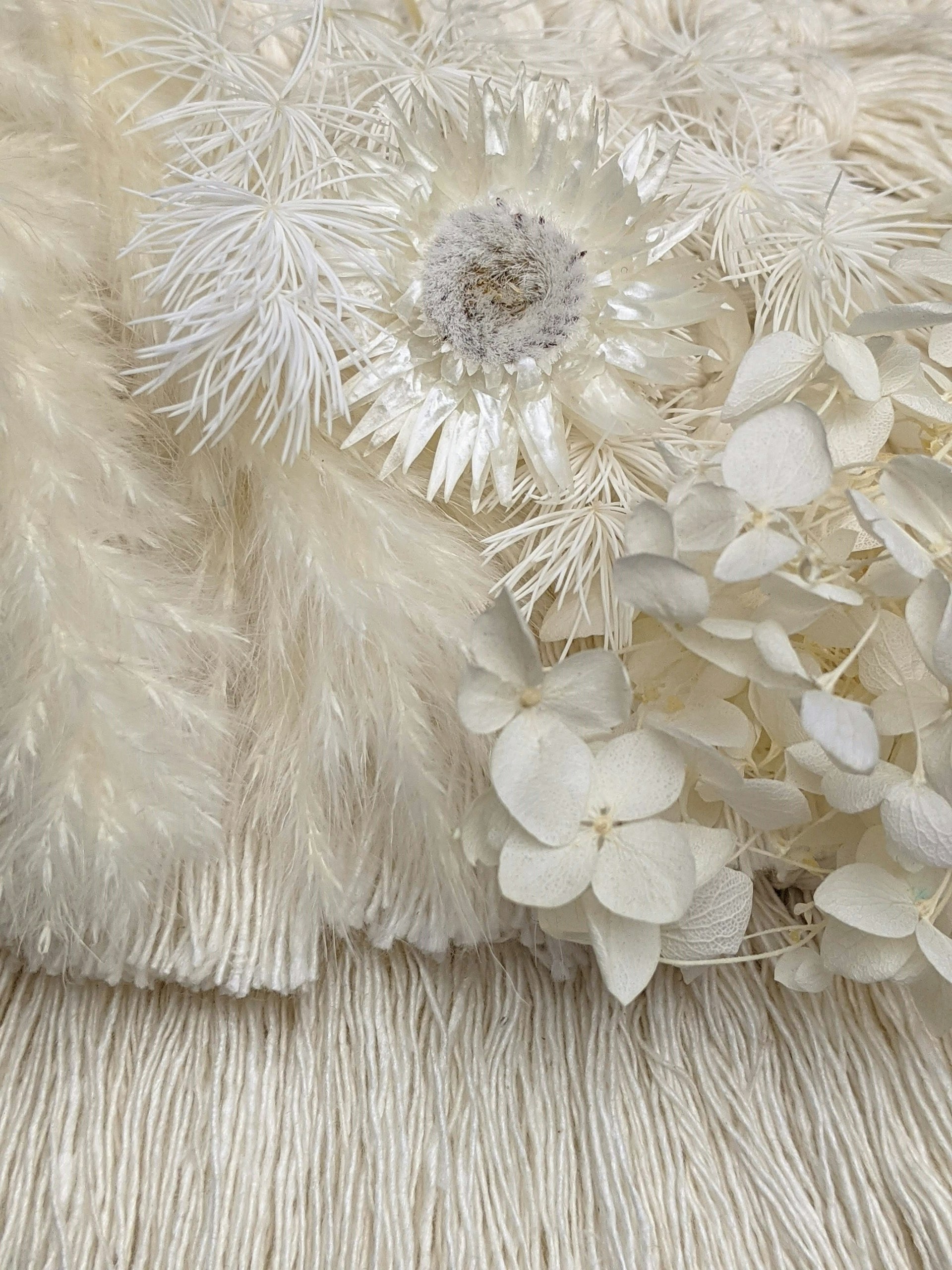 white flower on white textile