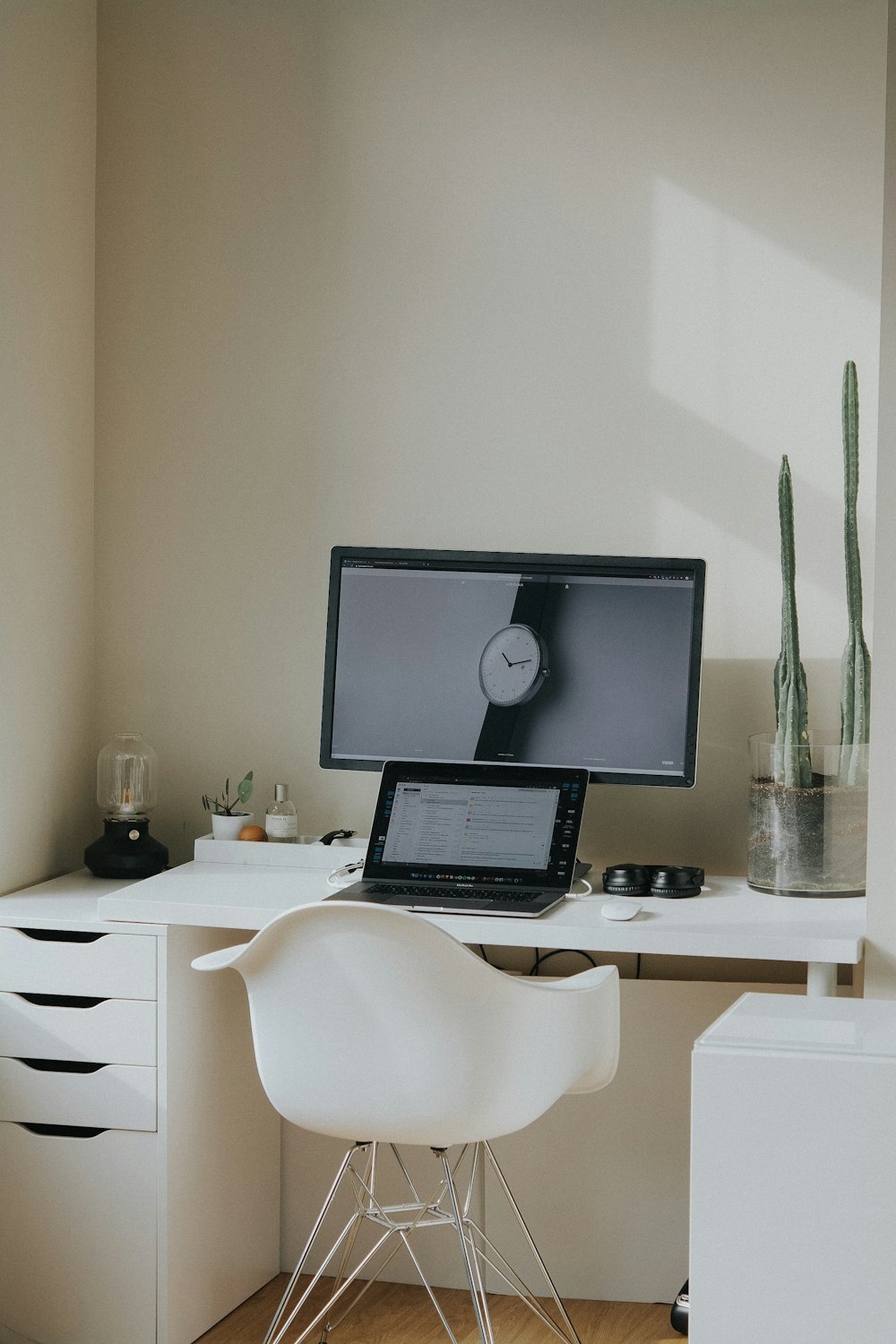 black laptop computer on white table