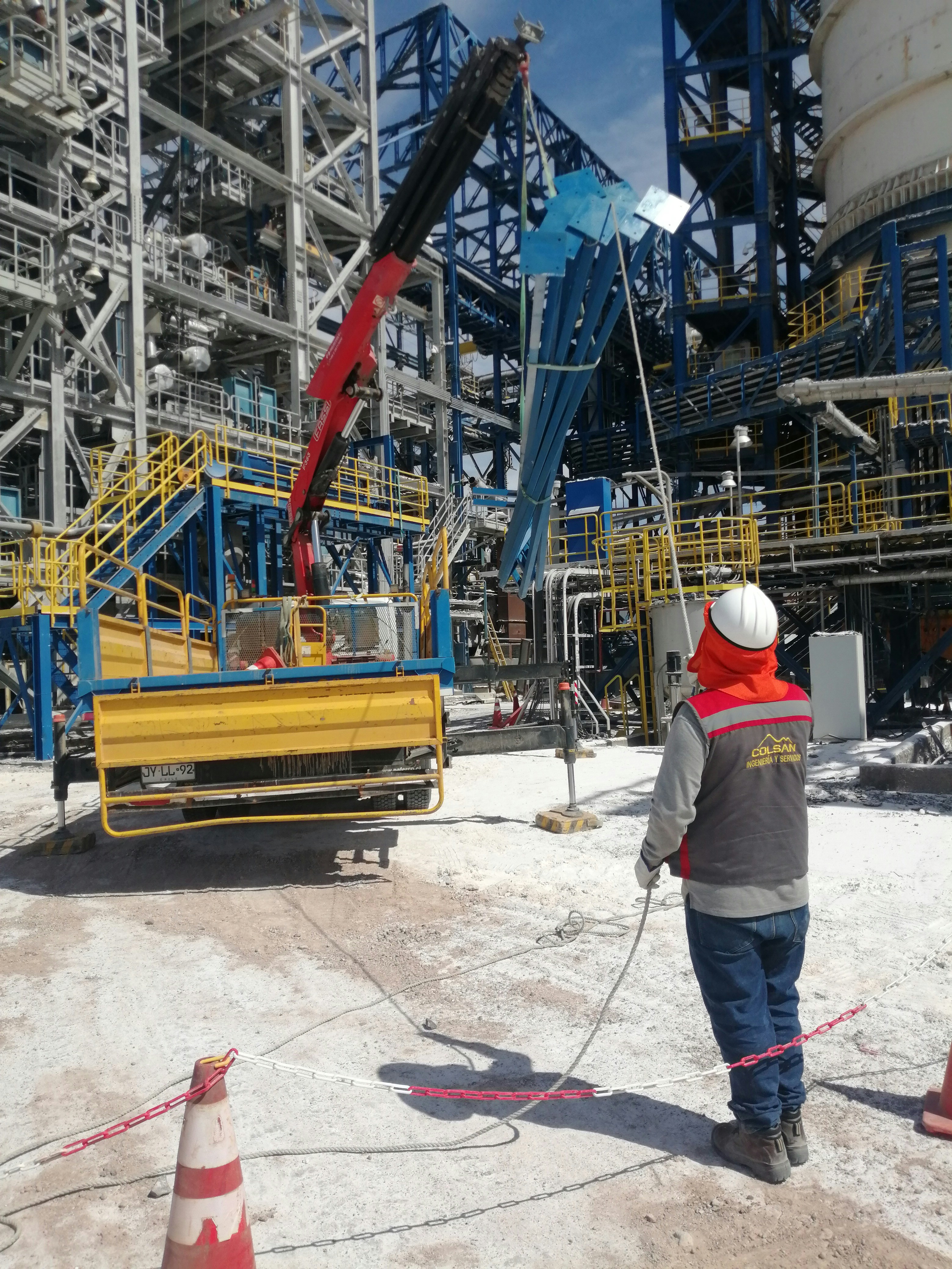 Miner Drilling Equipment at an Oil Rig Site