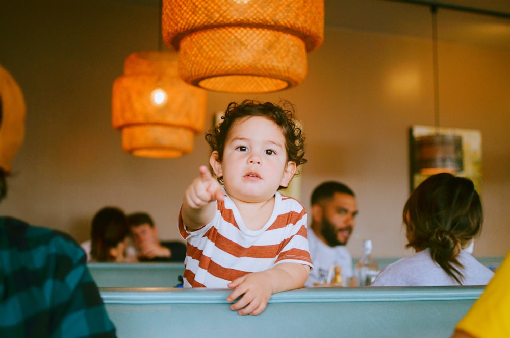 boy in white and red striped shirt