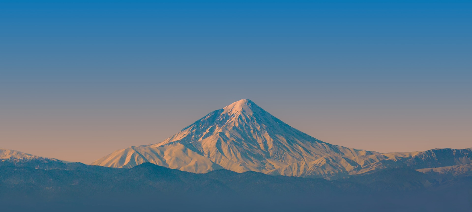brown and white mountain under blue sky during daytime