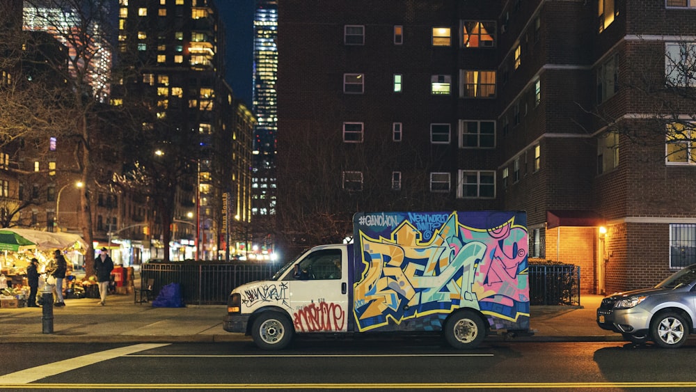 white and blue van on road near building during daytime