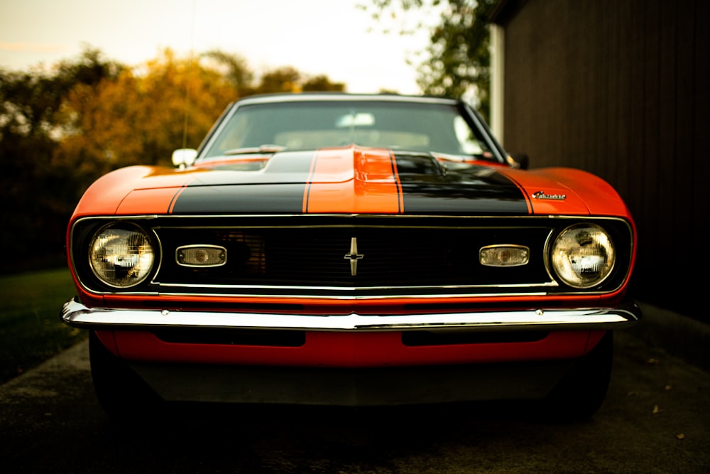 red and black chevrolet camaro