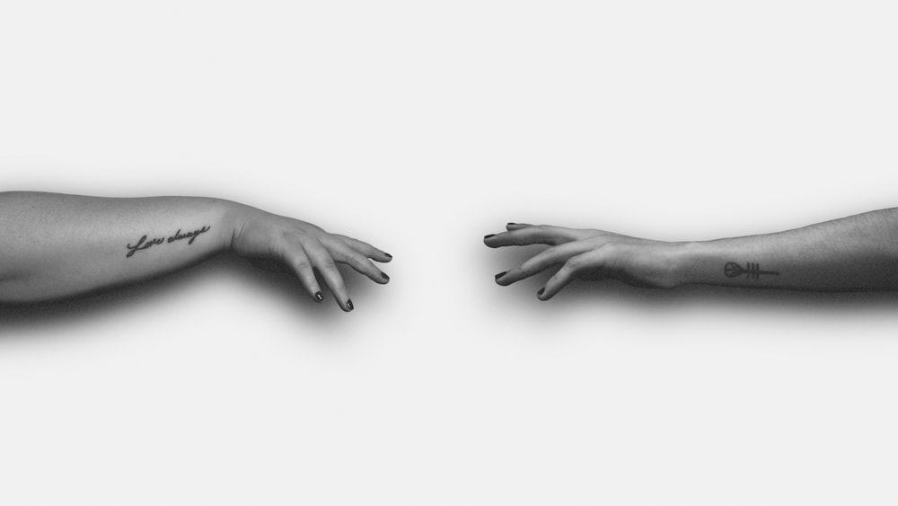 grayscale photo of persons hand