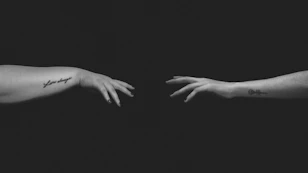 grayscale photo of persons hand