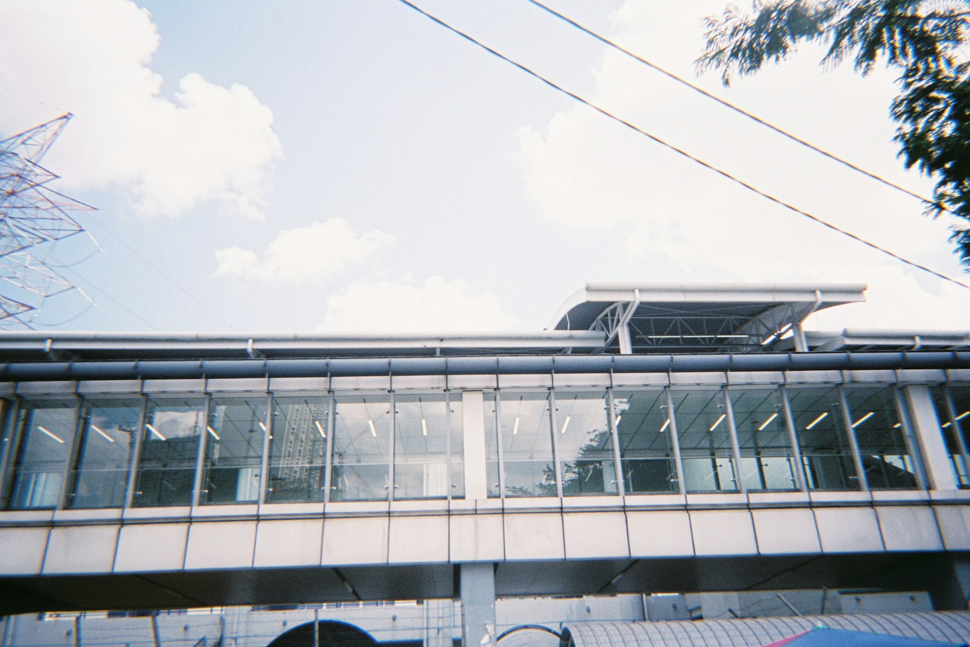 clear glass walled building under white clouds during daytime