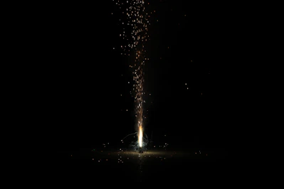 person standing on the ground with water droplets