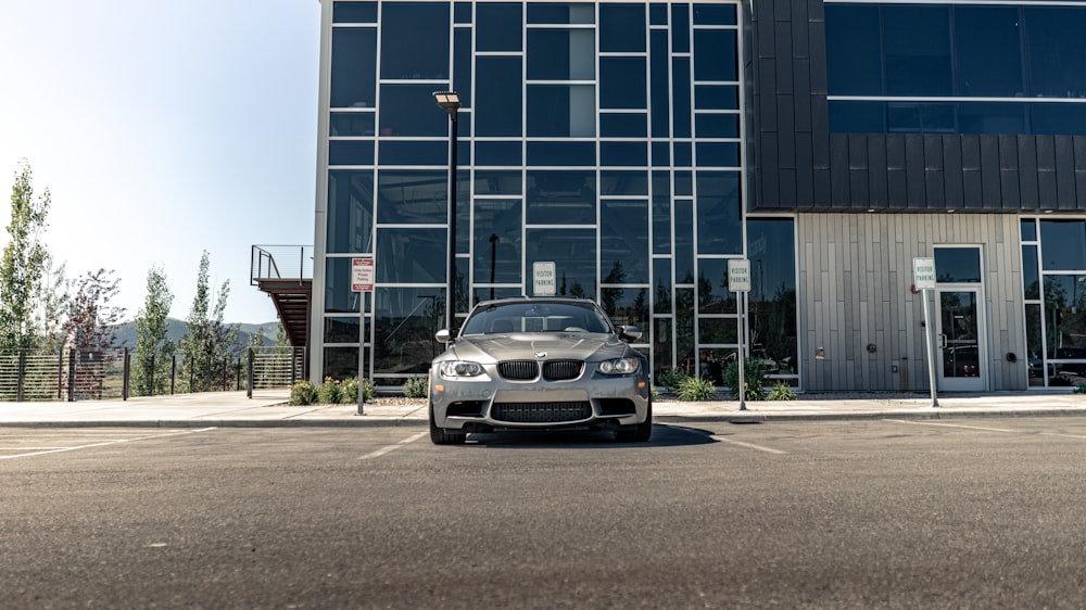 silver bmw m 3 parked on roadside near building during daytime