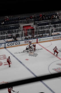A vibrant hockey rink filled with players in action.