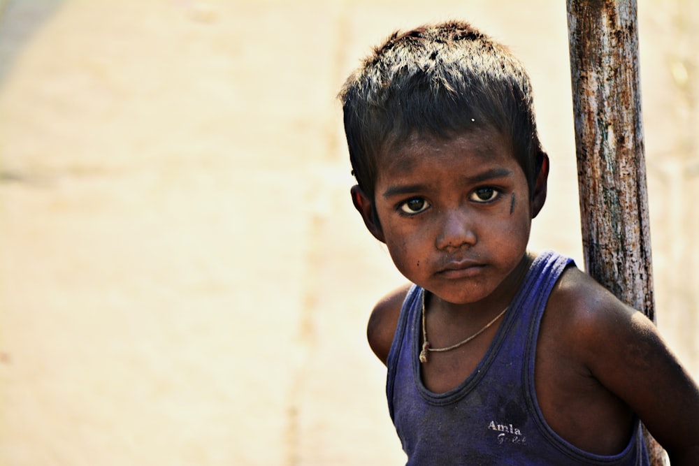 boy in blue tank top