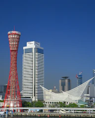 A vibrant cityscape showcasing a luxury hotel blending seamlessly with its local surroundings.