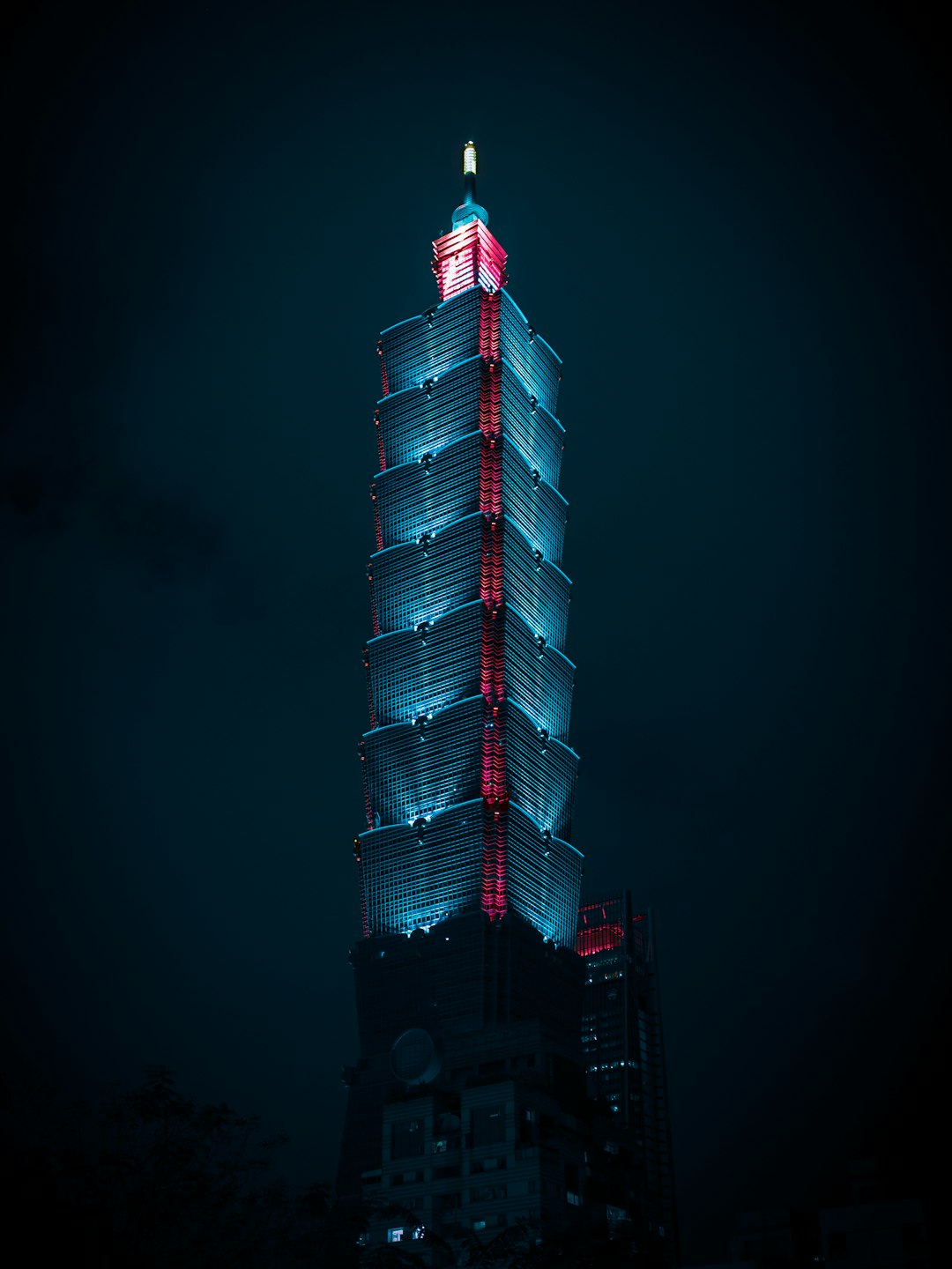 red and white tower during night time