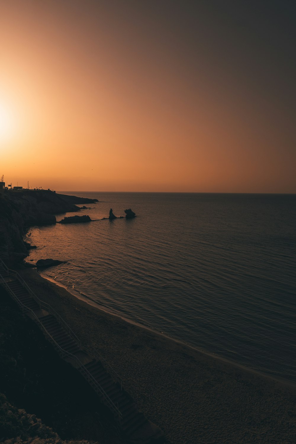 silhouette of people on beach during sunset