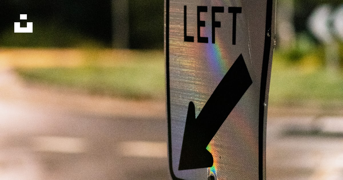 A keep left sign on the side of the road photo – Free Symbol Image on ...